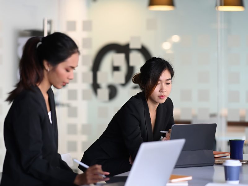 businesswoman-in-suit-experts-discussing-information-during-accounting-process-in-office-.jpg